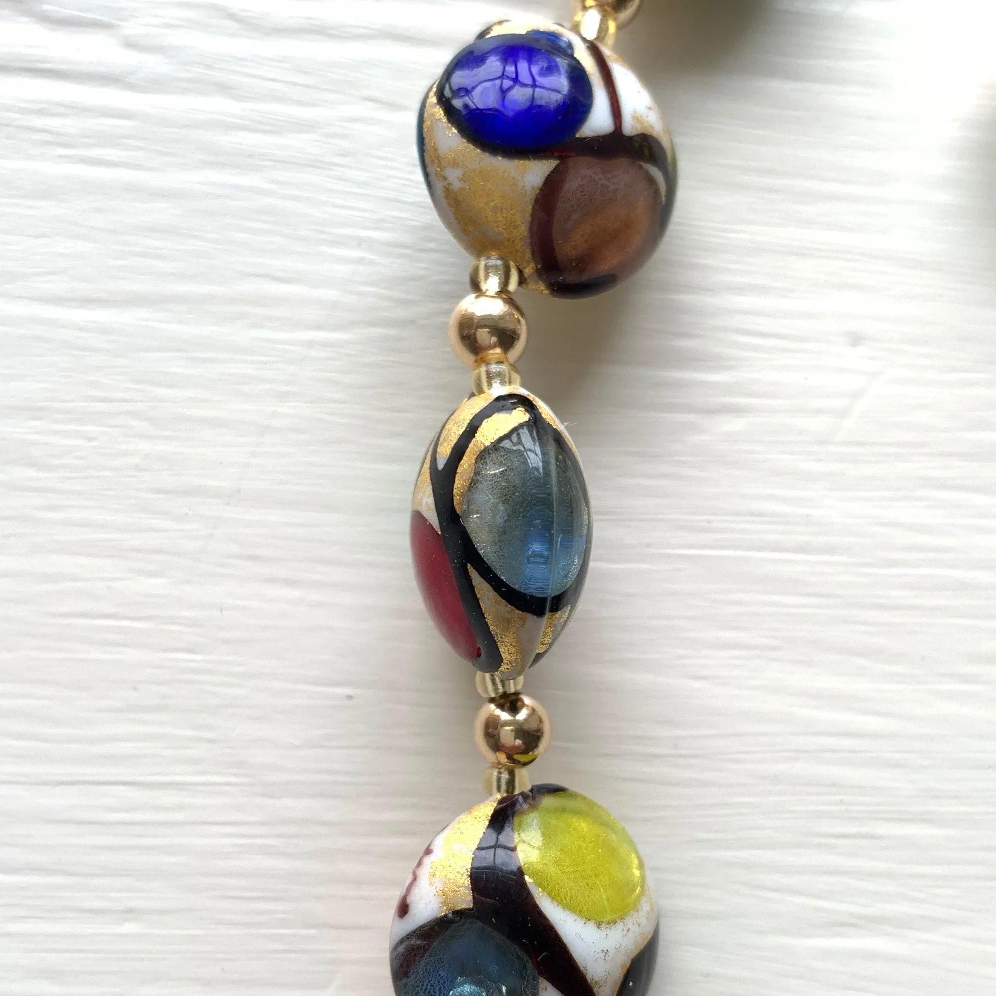 Necklace with multicolours, black and gold Murano glass large lentil beads on gold