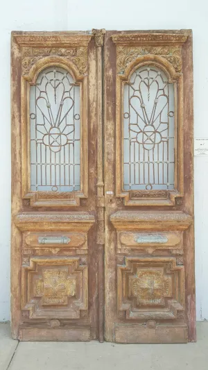 Pair of Ornate Wood Antique Carved Doors with Iron Inserts (no glass)