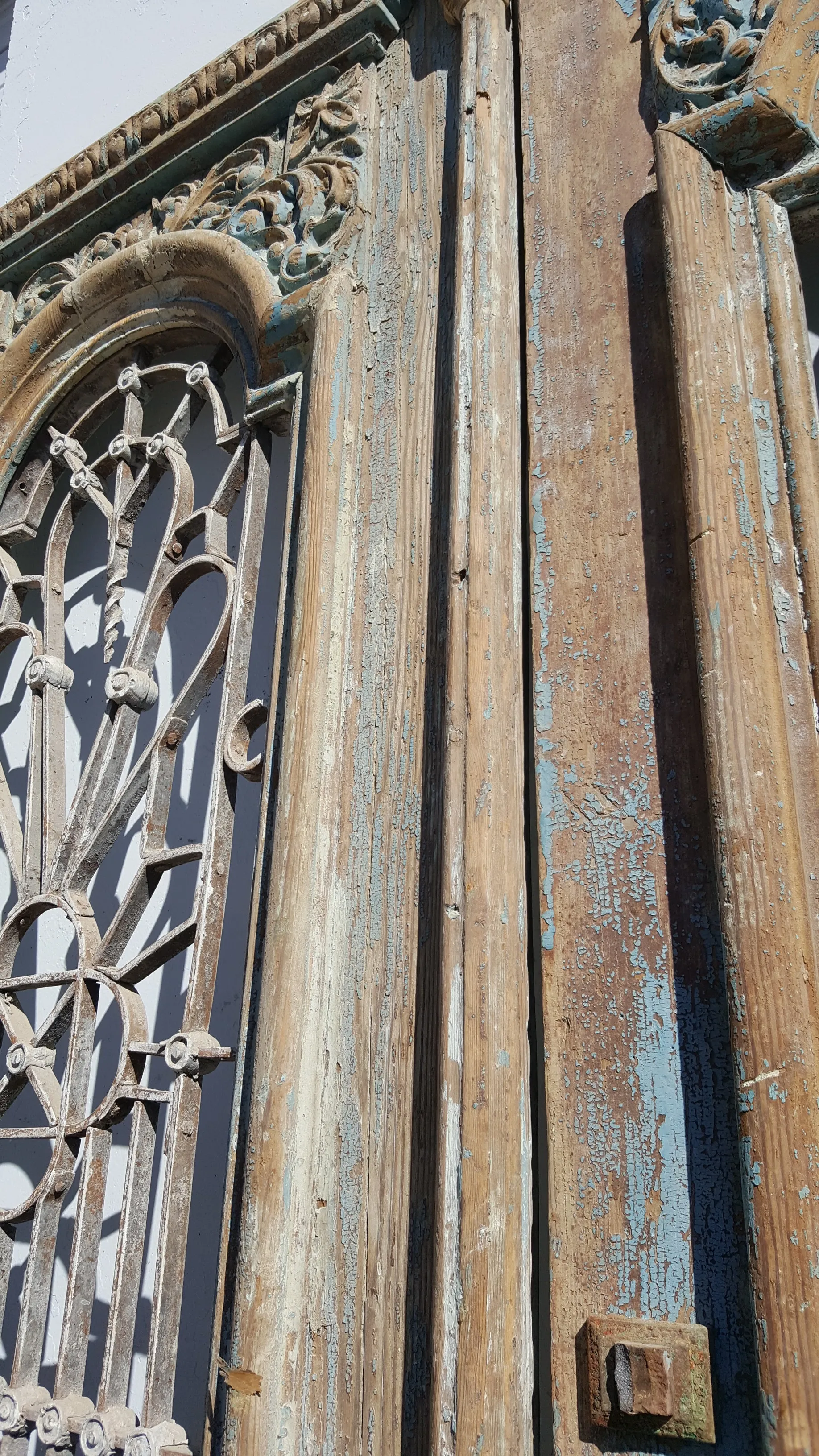 Pair of Ornate Wood Carved Antique Doors with Iron Inserts (no glass)